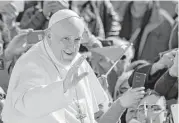  ?? Andrew Medichini / Associated Press ?? Pope Francis arrives for his weekly general audience Wednesday at the Vatican.