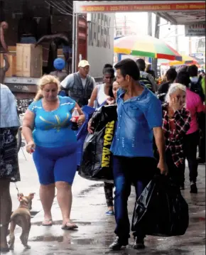  ??  ?? A Cuban shopping contingent in Georgetown