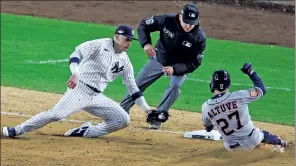  ?? Getty Images ?? OH NO YOU DON’T! Josh Donaldson gets back to third to tag out Jose Altuve to complete a double play in the ninth inning on Sunday.