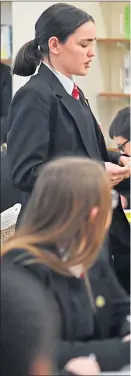  ??  ?? The Duchess of Sussex listens to a student reciting a poem at the Robert Clack Upper School in Dagenham on Internatio­nal Women’s Day on Friday