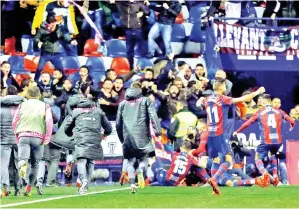  ??  ?? PARA pemain Levante meraikan jaringan lewat Pazzini (tidak kelihatan) pada perlawanan di Stadium Ciutat de Valencia, Valencia Sabtu lepas. — Gambar AFP