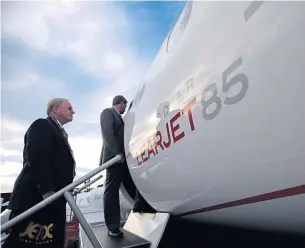 ?? BLOOMBERG ?? A file photo shows businessme­n boarding a Learjet 85 in Atlanta, Georgia.