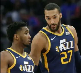  ?? DUANE BURLESON - THE ASSOCIATED PRESS ?? FILE - In this Saturday, March 7, 2020, file photo, Utah Jazz center Rudy Gobert (27) talks with guard Donovan Mitchell, left, during the second half of an NBA basketball game against the Detroit Pistons, in Detroit. Both players have tested positive for the coronaviru­s. Gobert’s test result forced the NBA to suspend the season.