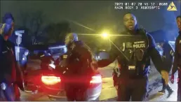  ?? City of Memphis photo via AP ?? Police officers talking after a brutal attack on Tyre Nichols by five Memphis police officers on Jan. 7, in Memphis, Tenn. are shown in this image from video released on Jan. 27. Nichols died on Jan. 10. The five officers have since been fired and charged with second-degree murder and other offenses.