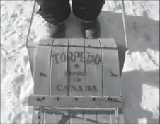  ?? DAVID BEBEE, RECORD STAFF ?? Bill Mitchell stands by his vintage Torpedo toboggan he has had since he was a child.