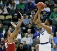  ?? KEITH SRAKOCIC — THE ASSOCIATED PRESS ?? Villanova’s Mikal Bridges (25) shoots over Alabama’s Galin Smith (30) during the first half of a second-round game in the NCAA men’s college basketball tournament, Saturday in Pittsburgh.