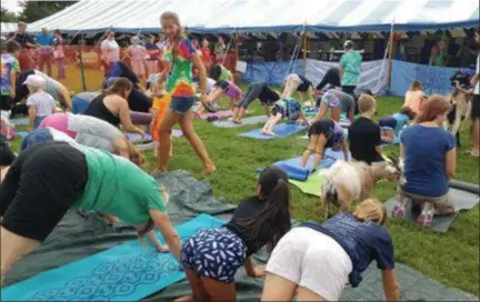  ?? SUBMITTED PHOTO ?? Ever tried yoga with a goat? Goat yoga is one of a variety of events at the Montgomery County Farm, Home & Youth Fair.