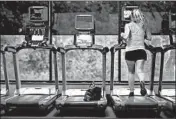  ?? STACEY WESCOTT/CHICAGO TRIBUNE ?? Suzi Henschel, of Northbrook, runs on the treadmill Friday at North Suburban YMCA in Northbrook.