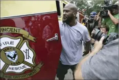  ??  ?? Steelers linebacker James Harrison arrives at camp in a Saint Vincent Fire Department fire truck.