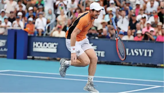  ?? Picture: Al Bello/Getty ?? Andy Murray screams in pain after hurting his left ankle during his match with Tomas Machac in Miami