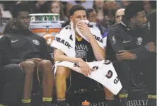  ?? Santiago Mejia / The Chronicle ?? Warriors guard Klay Thompson gets a breather during the second half against the New Orleans Pelicans, who needed to beat Golden State to keep pace in the playoff race — and did, 126-120.