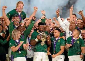 ?? AP ?? Springboks players celebrate with the Webb Ellis Cup after beating England in the 32-12 in the World Cup final.