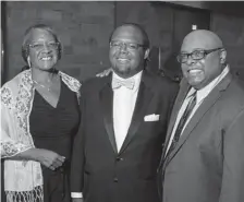  ??  ?? Myles King, center, and a Hero of the Year, with parents, Tree and Larry King.