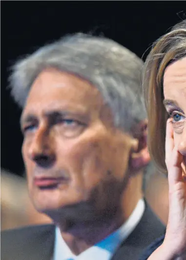  ??  ?? Philip Hammond, Amber Rudd and Boris Johnson listen to Mrs May’s speech