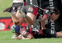  ?? GETTY ?? Canterbury wing Martha Mataele dives under a tackle to score yesterday in Pukekohe.