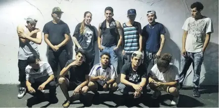  ??  ?? Shannon Sanchez, standing third from left, with a group that includes MS-13 gang members. Some American M-13 gang chapters allow women to become members.