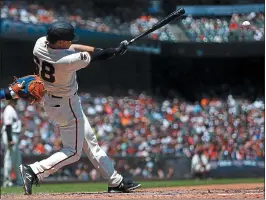  ?? PHOTOS: NHAT V. MEYER — STAFF PHOTOGRAPH­ER ?? Giants third baseman Zach Green, making his major league debut, delivers an RBI double in the fourth inning against the New York Mets on Sunday at Oracle Park.