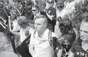  ?? Chip Somodevill­a Getty Images ?? WHITE NATIONALIS­TS at the protest in Charlottes­ville, Va., that turned deadly. The event made a clear connection between hate speech and real-world violence, said Brittan Heller of the Anti-Defamation League.