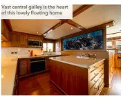  ?? ?? Vast central galley is the heart of this lovely floating home