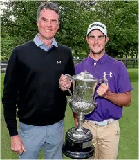 ??  ?? Charlie Smail celebrates his NZ amateur men’s golf title win with father David Smail.