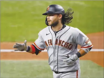  ?? Tribune News Service/getty images ?? Brandon Crawford of the San Francisco Giants celebrates after hitting a solo home run against the Texas Rangers in the sixth inning at Globe Life Field June 8 in Arlington, Texas.