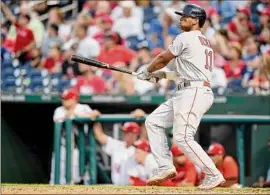  ?? Greg Fiume / Getty Images ?? Rafael Devers of the Boston Red Sox hits the game-winning two-run home run in the ninth inning against Washington.