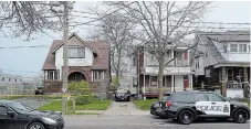  ?? DAVE JOHNSON TORSTAR ?? Two Niagara Regional Police cruisers sit in front of two Division Street homes. Police were called to the area for a report of a disturbanc­e. One person died at the scene.