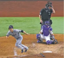  ?? Ronald Martinez / Getty Images ?? Tampa Bay’s Joey Wendle leaves the batter’s box on his tworun double in the fourth inning Wednesday.