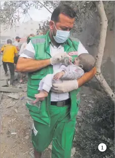  ?? Pictures: AP ?? 1. A doctor rescues a child in Gaza.