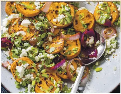  ??  ?? AMERICA’S TEST KITCHEN Feta and chipotle jazz up grilled sweet potatoes for your next barbecue.