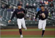  ?? ROSS D. FRANKLIN — THE ASSOCIATED PRESS NEWS-HERALD.COM ?? Yu Chang, left, jogs off the field with shortstop Tyler Freeman during a spring game against the Giants.
Online: Did you miss our season preview in the March 31 edition? Read the stories at: