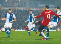  ?? (Reuters) ?? MANCHESTER UNITED Swedish hitman Zlatan Ibrahimovi­c scores the winning goal during United’s 2-1 away victory against the Blackburn Rovers yesterday in the FA Cup fifth round.