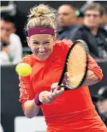  ?? PHOTOS: GETTY IMAGES ?? Tough tennis . . . Left: Venus Williams of the US is unhappy with the shot she has played against opponent Victoria Azarenka of Belarus at the ASB Classic in Auckland yesterday. Right: Azarenka plays a backhand during the match.