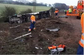  ?? ?? WRECKAGE: The HGV on its side after being forced off the M1. The injured lorry driver had to be cut out of his cab by the fire and rescue service