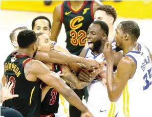  ?? AFP PHOTO ?? Tristan Thompson No. 13 of the Cleveland Cavaliers and Draymond Green No. 23 of the Golden State Warriors exchange words in overtime during Game 1 of the 2018 NBA Finals at ORACLE Arena on Friday in Oakland, California.