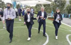  ?? — Reuters ?? Craig Tiley, CEO of Tennis Australia (2nd R), after a press conference. Play on Thursday was cancelled after a quarantine­d hotel worker in Melbourne returned Covid positive result.