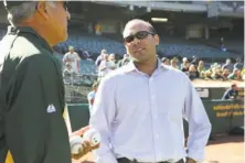  ?? Travis LoDolce / A’s 2013 ?? MIT-educated Farhan Zaidi (right), who formerly worked for the A’s, has a doctorate in behavioral economics from Cal.