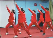  ??  ?? Children at Sun Village perform for visitors in Shunyi.