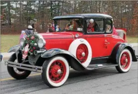  ?? FILE PHOTO. ?? An antique car rolls down Route 9 during the 38th annual holiday parade in South Glens Falls.