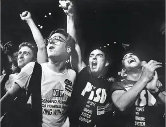  ?? Scott Sommerdorf / The Chronicle 1990 ?? Above: Putting political statements on T-shirts has a long history in the Bay Area. Shirts from the AIDS direct-action group ACT UP were a common sight at protests during the 1980s and 1990s.