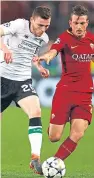  ?? Picture: Getty. ?? Andy Robertson of Liverpool, left, takes on Roma’s Alessandro Florenzi during the Champions League semi-final second leg clash in Rome.