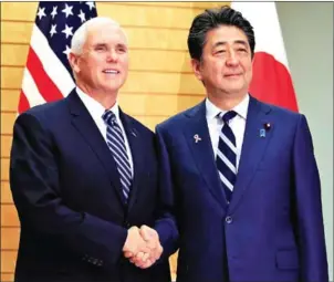  ?? AFP ?? US Vice President Mike Pence (left) shakes hands with Japanese Prime Minister Shinzo Abe at the start of their meeting at the prime minister’s official residence in Tokyo.