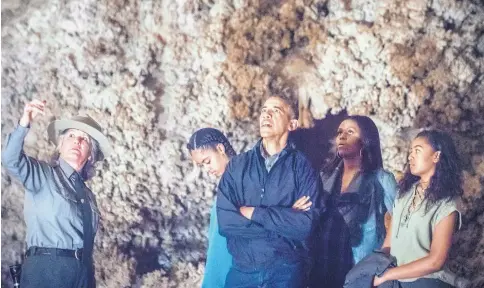  ?? ROBERTO E. ROSALES/JOURNAL ?? President Barack Obama and his family, Sasha, second from left, Michelle, second from right, and Malia, right, listen to Valerie Gohlke, left, a public affairs specialist for the National Park Service, as they tour Carlsbad Caverns on Friday.