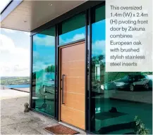  ??  ?? This oversized 1.4m (W) x 2.4m (H) pivoting front door by Zakuna combines European oak with brushed stylish stainless steel inserts