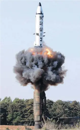 ?? KOREAN CENTRAL NEWS AGENCY / KOREA NEWS SERVICE VIA AP FILES ?? A solid-fuel Pukguksong-2 missile lifts off during its launch test in North Korea last May. Pyongyang is just as unwilling to give up its nuclear program as the U.S. is to let it keep its arsenal.