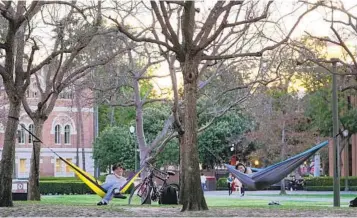  ?? DAMIAN DOVARGANES AP FILE ?? College students enjoy the outdoors at the University of Southern California on March 1. The U.S. grew wealthier and better educated during the second half of the last decade, according to the U.S. Census Bureau.