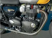  ??  ?? No silly fake carburetto­rs cast into the intakes of Triumph’s 900cc twin; otherwise appears identical to 1200cc version.