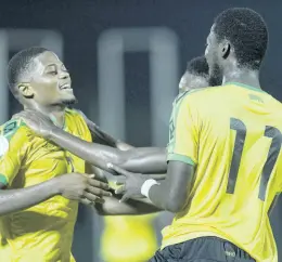  ?? FILE ?? Reggae Boyz striker Leon Bailey (left) celebrates with Devon Williams (partially hidden) and Shamar Nicholson during Jamaica’s Concacaf Nations League match against Antigua and Barbuda at the Montego Bay Sports Complex on Friday, September 6,2019. Jamaica won 6-0.