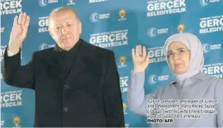  ?? PHOTO: AFP ?? Turkish president and leader of Justice and Developmen­t Party Recep Tayyip Erdogan (with his wife Emine Erdogan, wave to supporters in Ankara.