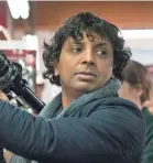  ??  ?? Filmmaker M. Night Shymalan’s cameo in “Glass” connects to both “Unbreakabl­e” and “Split.”